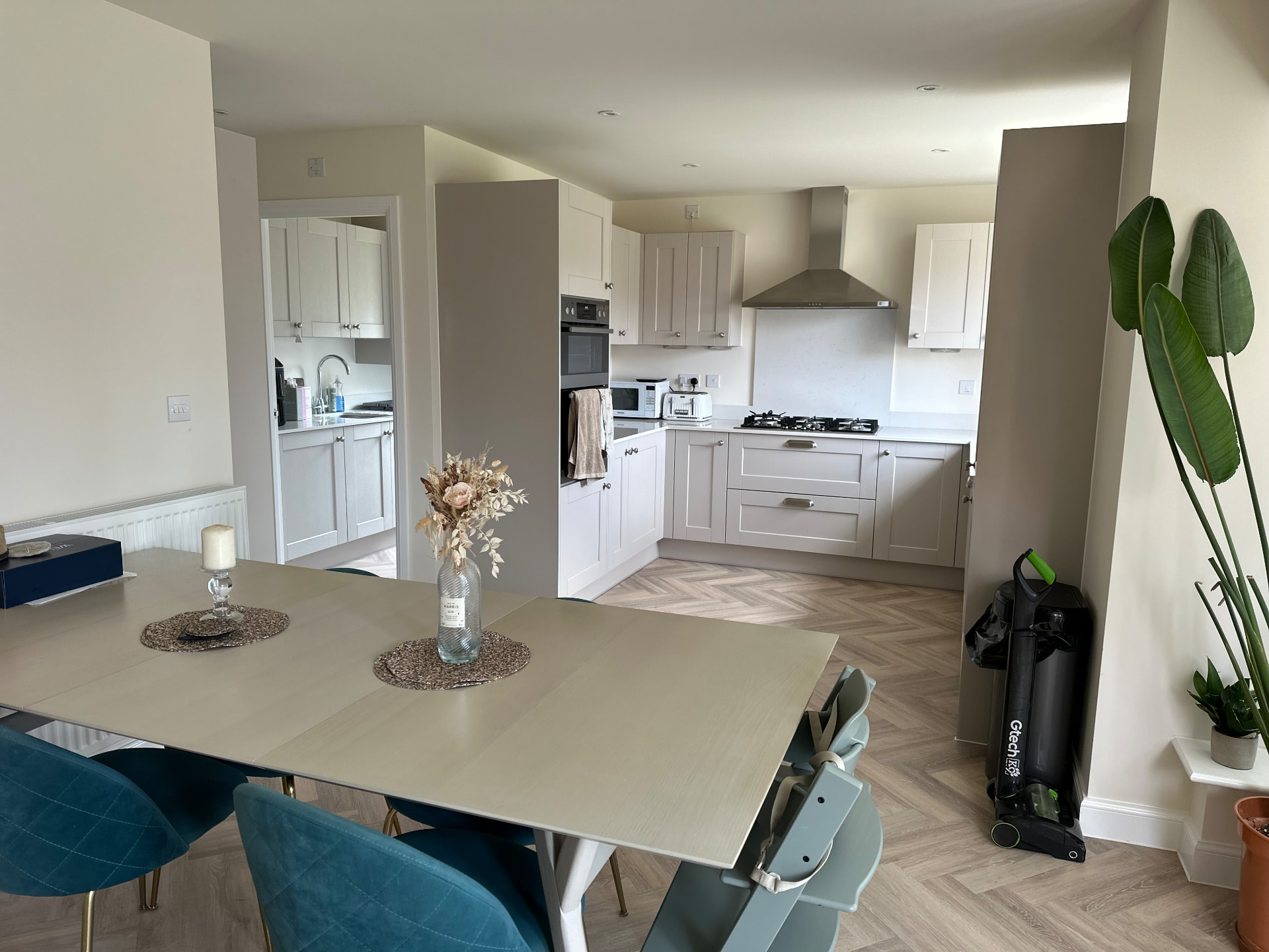 Neutral shaker kitchen and open-plan dining area