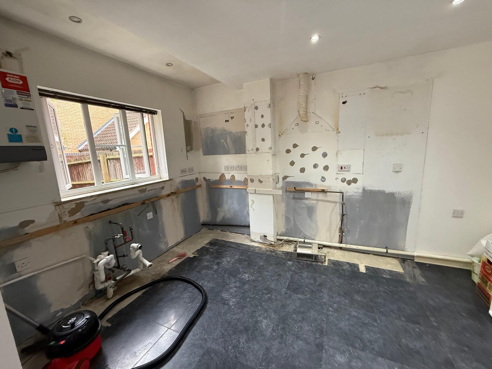 The room stripped bare, ready for the new kitchen
